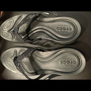 NWOT CROCS black flip flops with a little sparkle